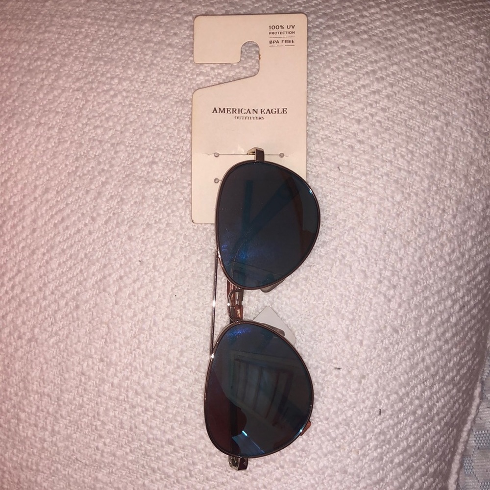 Never worn blue tinted American Eagle aviators